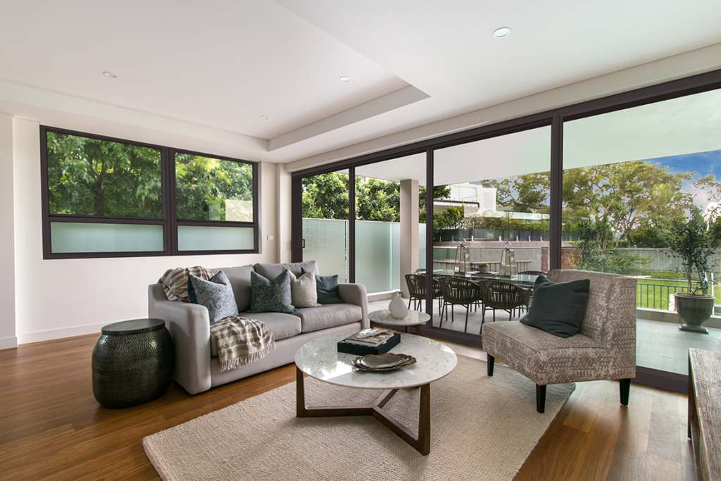 Beautiful living room with hurricane impact windows and doors